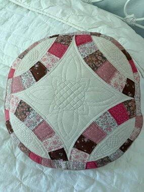Round Patchwork Quilted Pillow in Pink and Brown